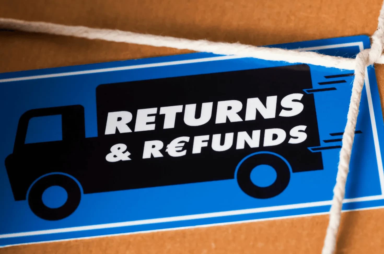 A shipping box with a label reading “Returns & Refunds”, representing easy return processes.