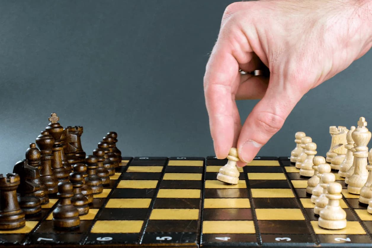 Chessboard with strategic pawn movement symbolising calculated Amazon ad strategy decisions using Autron
