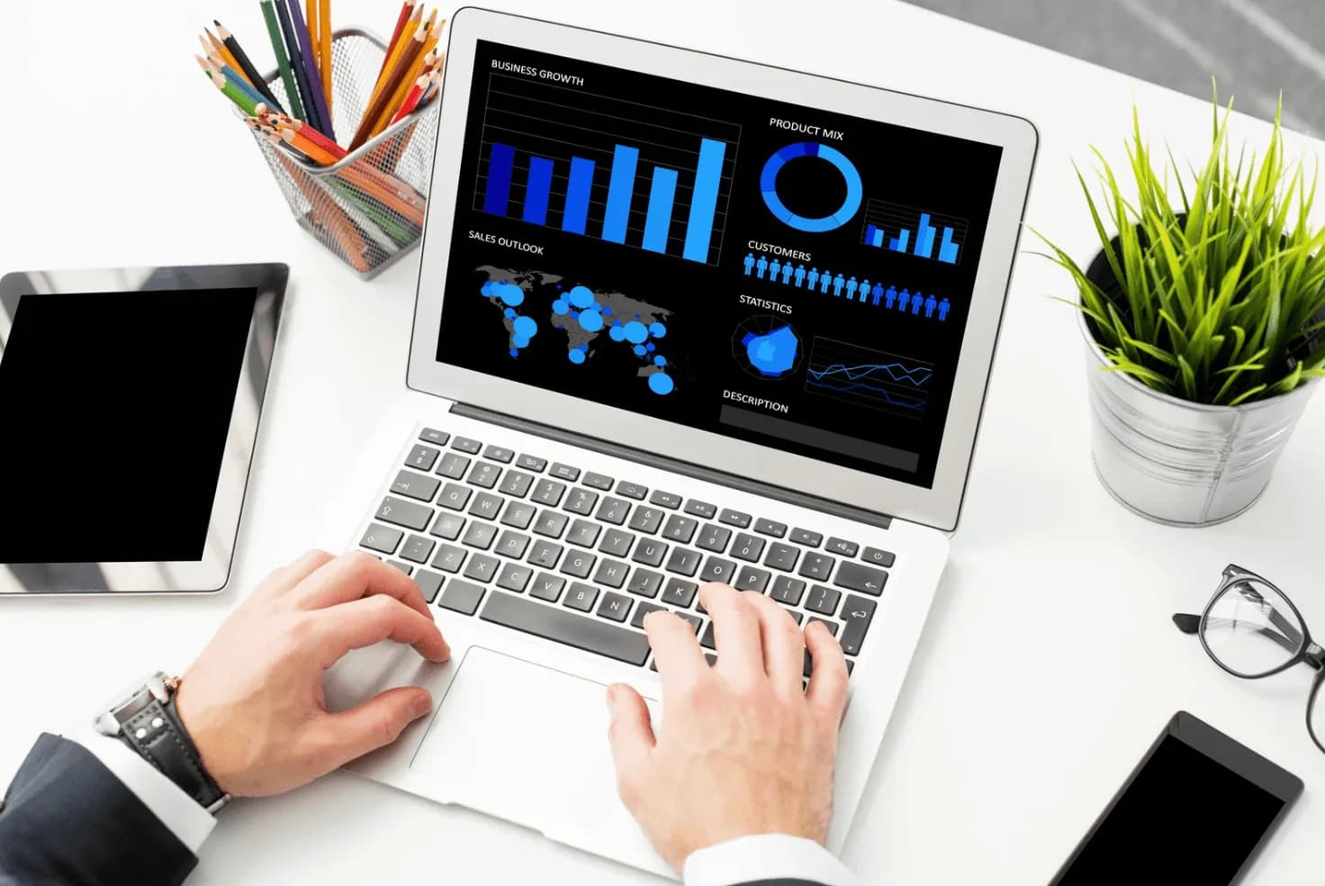 Laptop displaying business growth charts and Amazon ad performance metrics, highlighting automation, bid management, and budget allocation features.