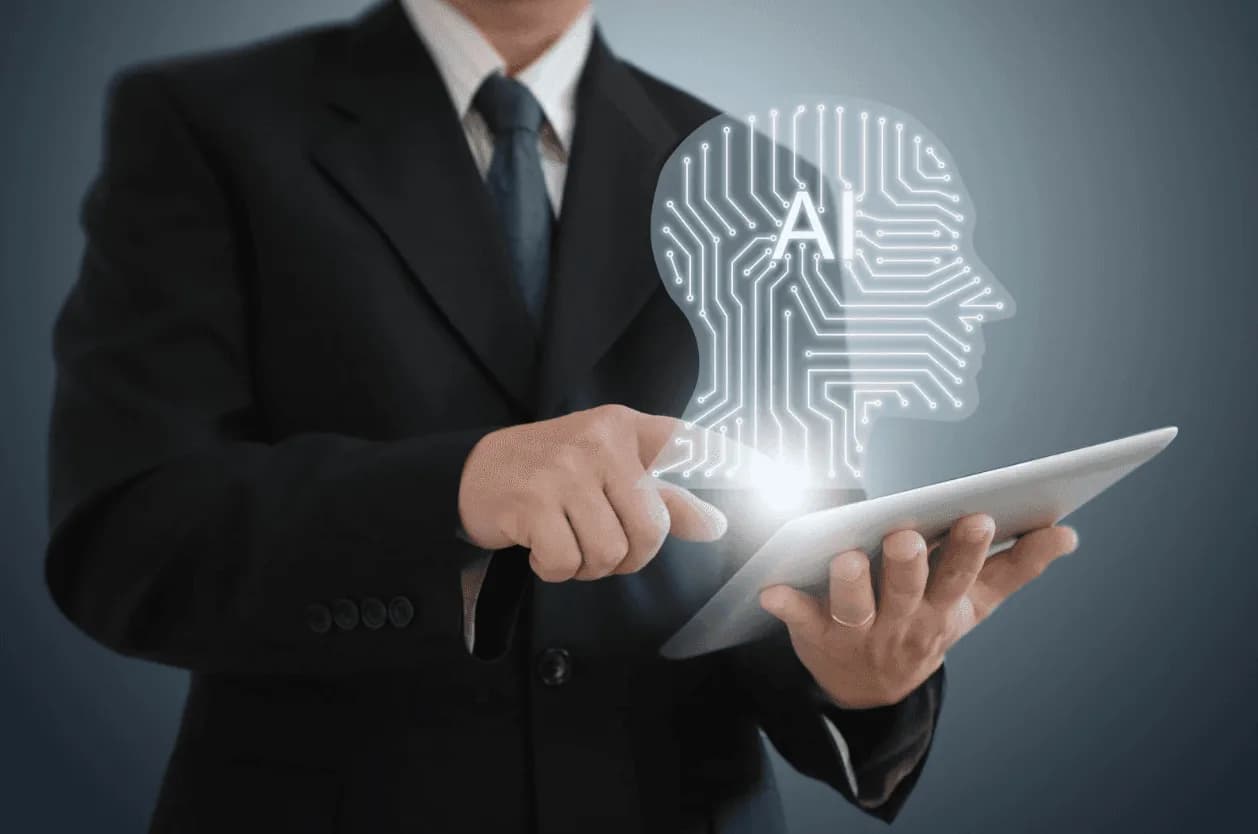 Businessman using a tablet with digital AI brain overlay – showing AI integration for smarter Amazon PPC management.