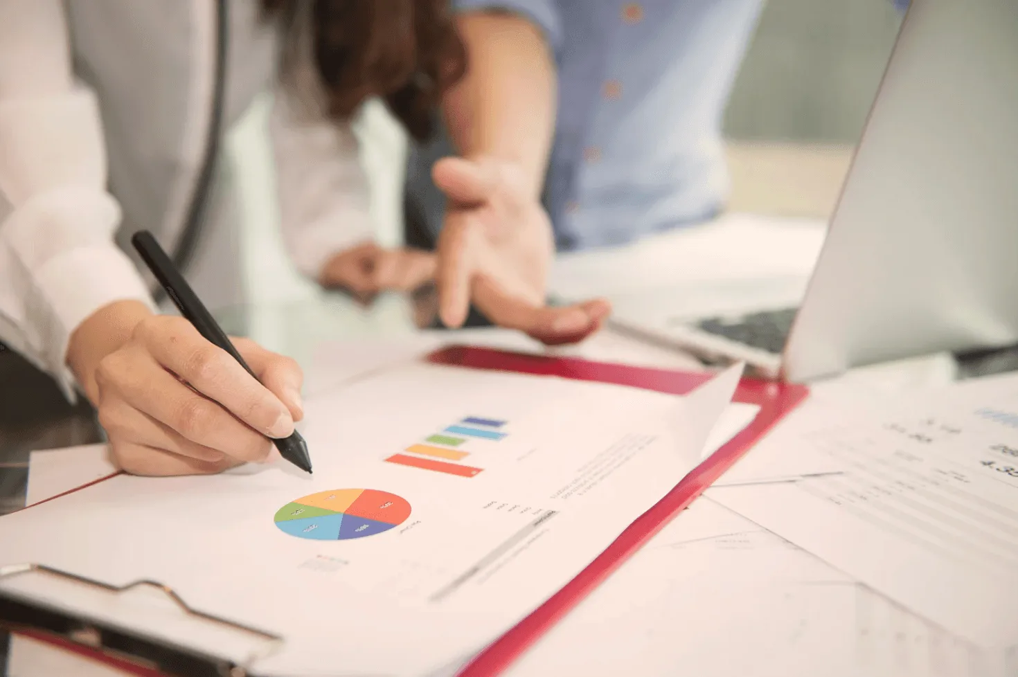 Businesswoman analyzing long-tail keywords on tablet for profitable Amazon ads