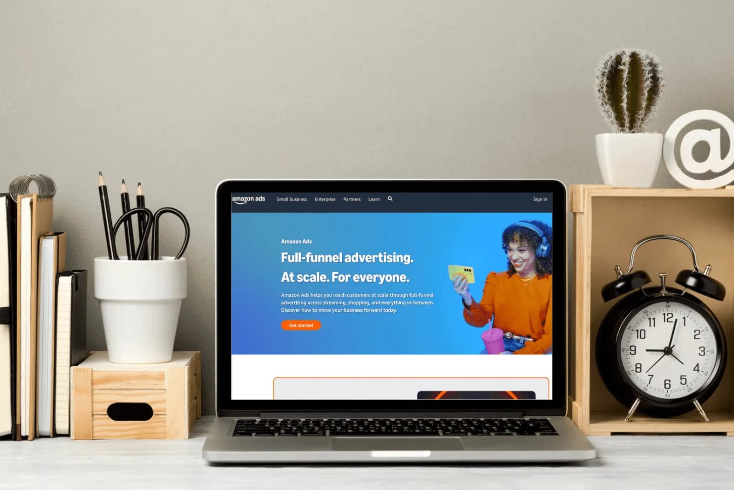 Laptop displaying Amazon Ads dashboard on a desk, representing automated and intelligent ad campaign management.