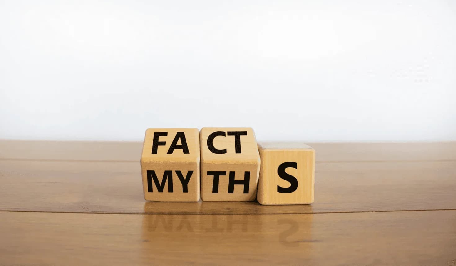 Wooden blocks displaying fact versus myth concept representing common Amazon PPC misconceptions and campaign assumptions