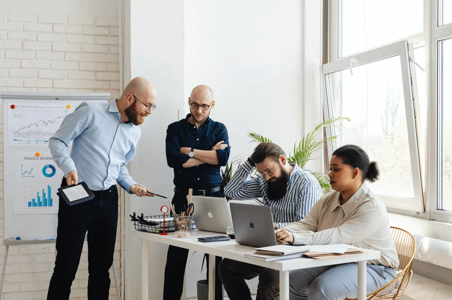 Team reviewing Amazon advertising performance charts in an office, illustrating how over-specialisation leads to blind spots and missed cross-campaign insights.