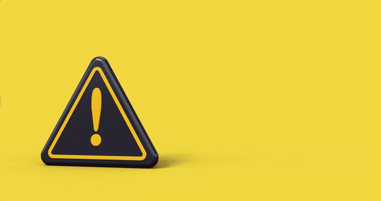 Yellow caution triangle with exclamation mark on vibrant background, symbolising potential risks in misleading ad growth