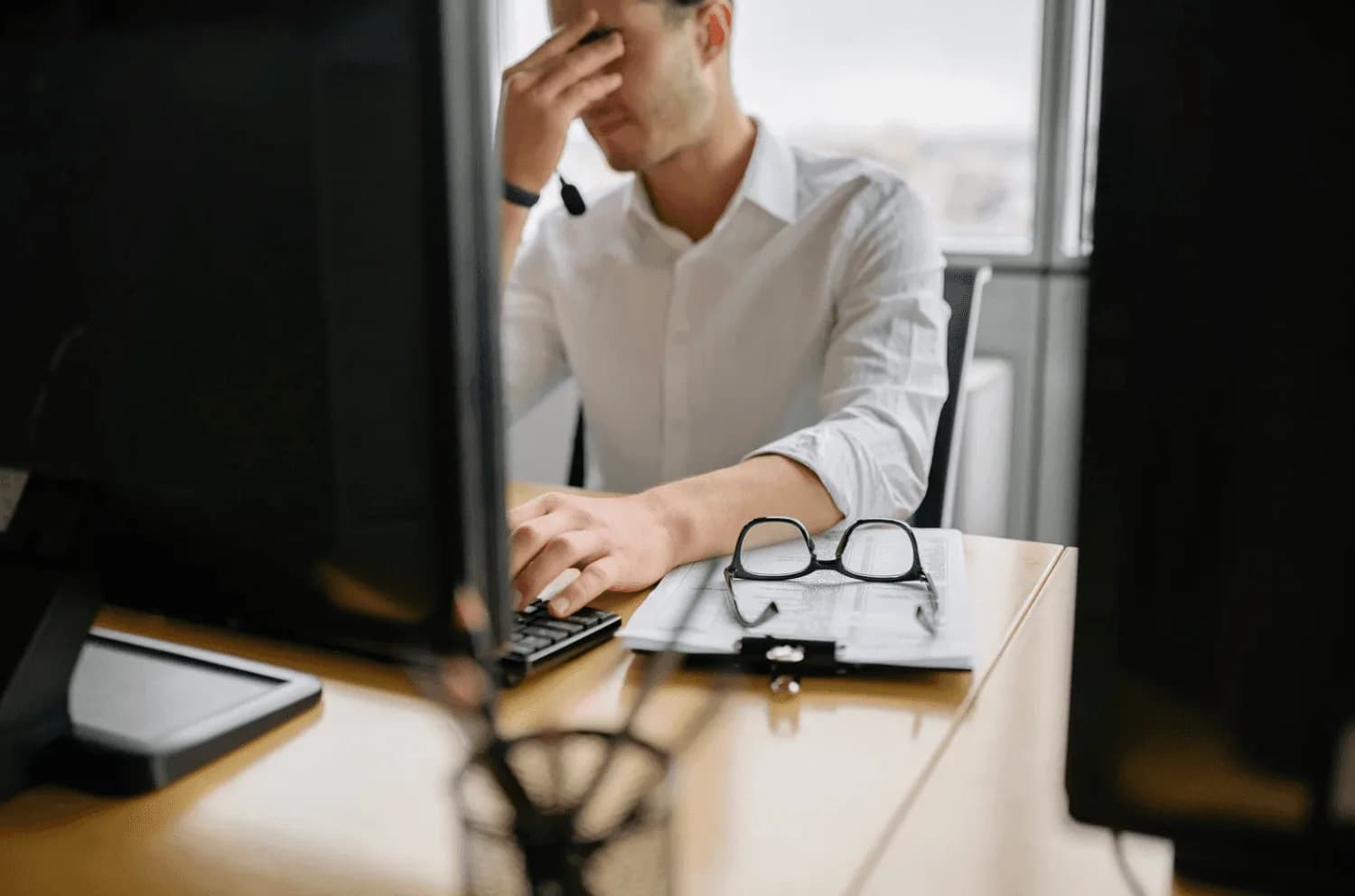 Amazon seller reviewing campaign performance charts and analytics while looking frustrated, highlighting the limits of customer support for strategic advertising decisions.